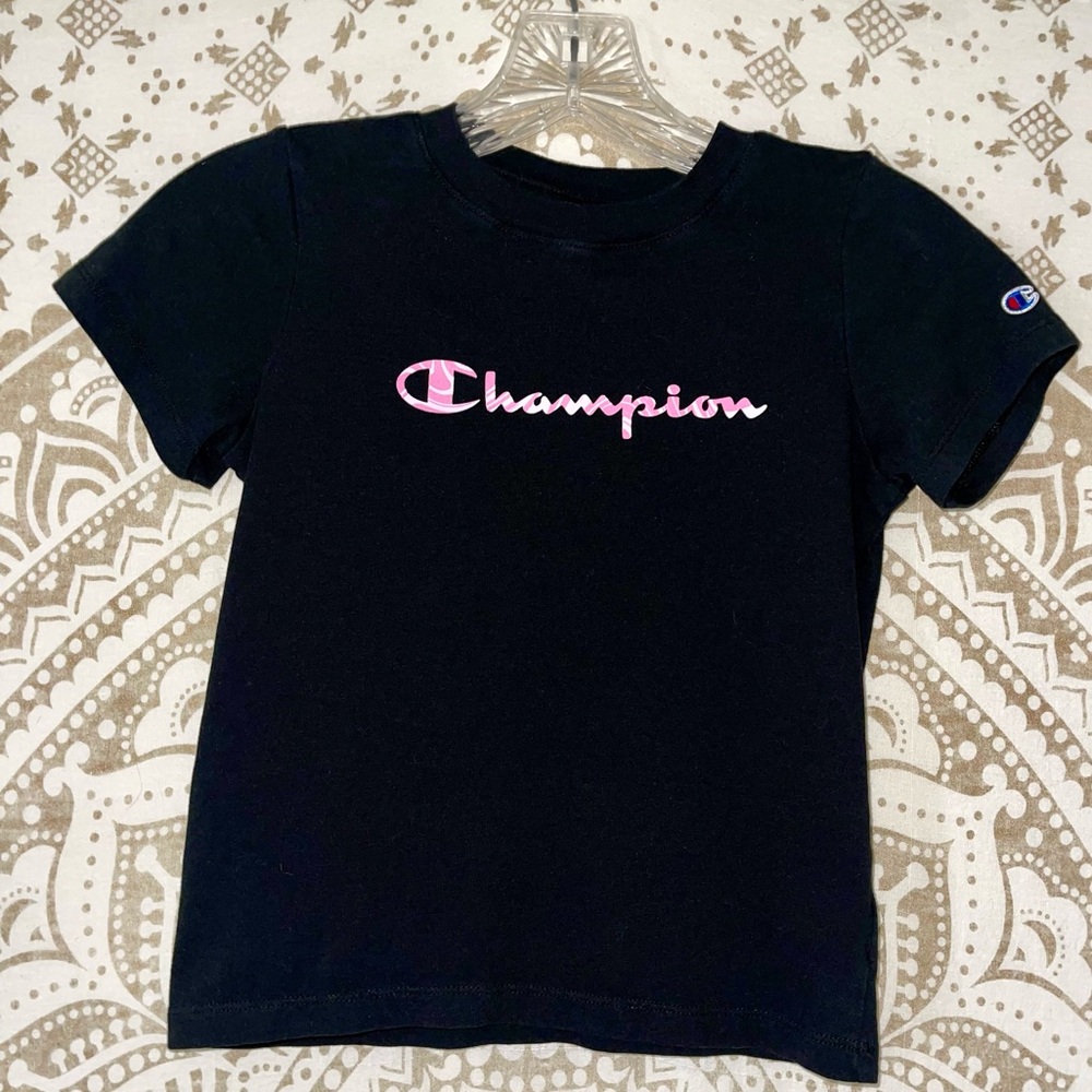 "CHAMPION" GIRLS BLACK SHORT SLEEVE TOP WITH GRAPHIC ON BODICE, SIZE SMALL (7-8)